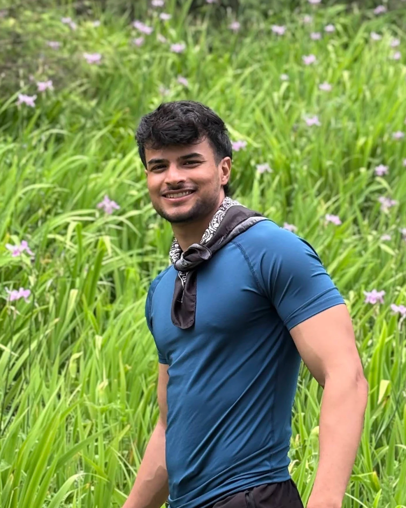 Mohit Gautam outdoors among lush greenery